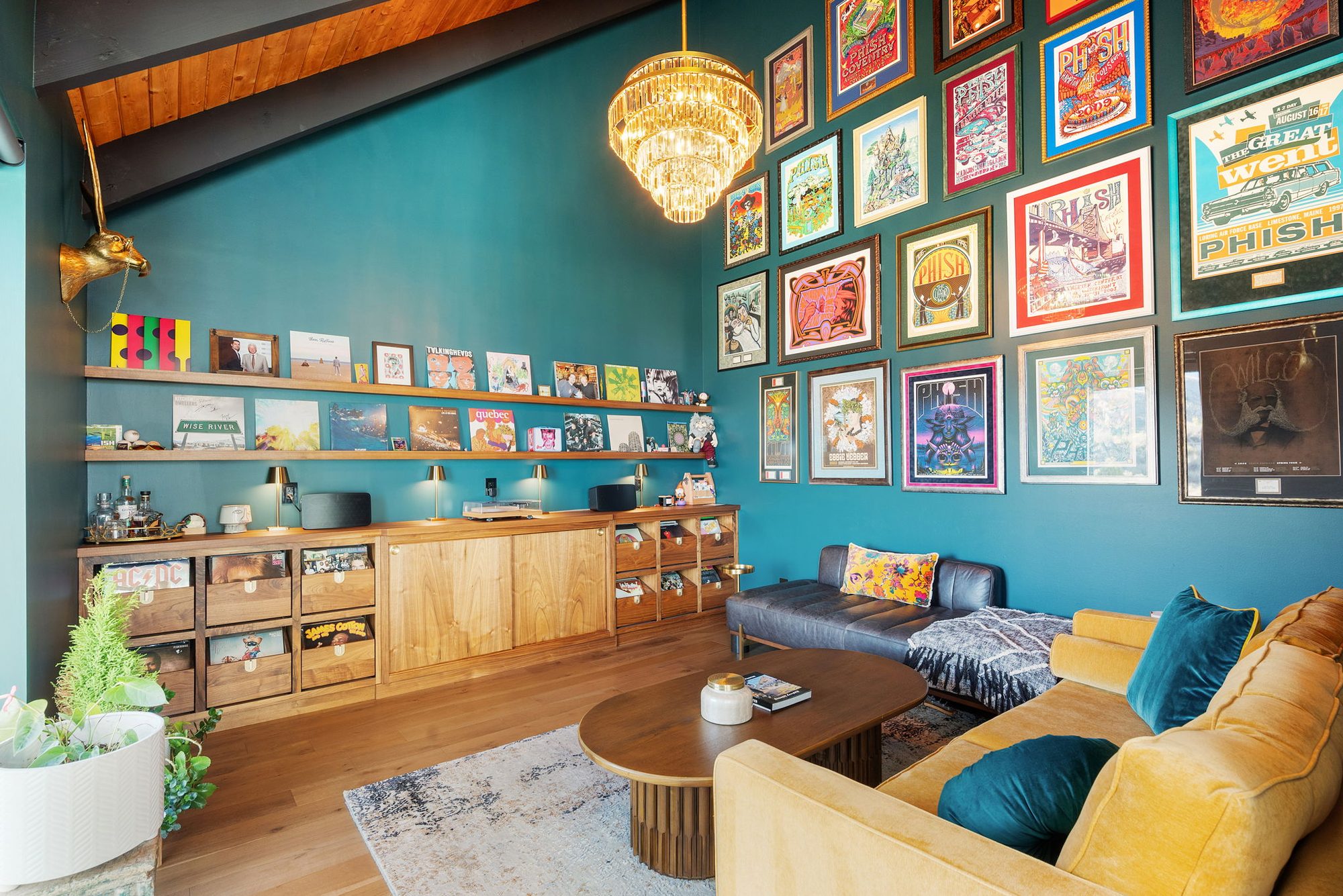 Music Lounge with speakeasy-green walls, framed concert posters and a wall of records